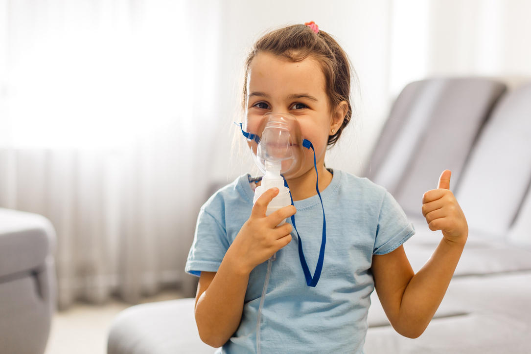 Little Girl Use Inhaler Nebulizer. Child Asthma Inhaler, Nebulizer Steam, Flu or Cold Concept. Copyspace